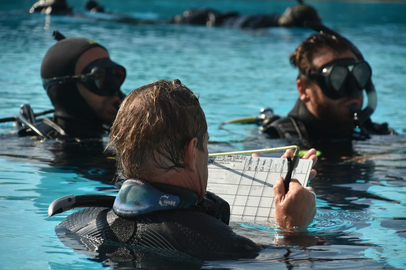 Instructor briefing divers during open water training