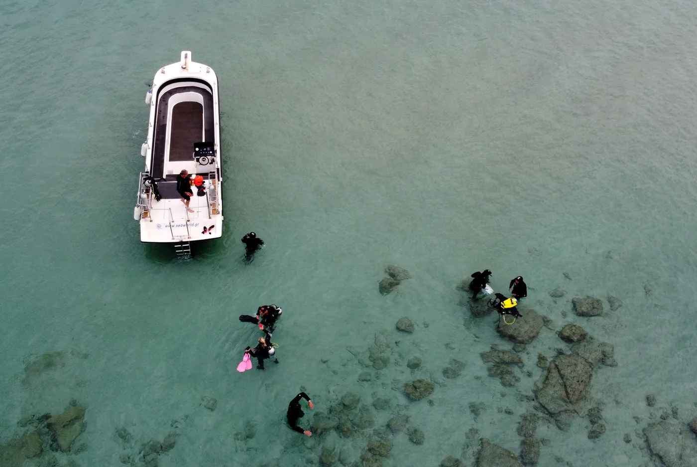 Aerial view of the training boat and divers in shallow water