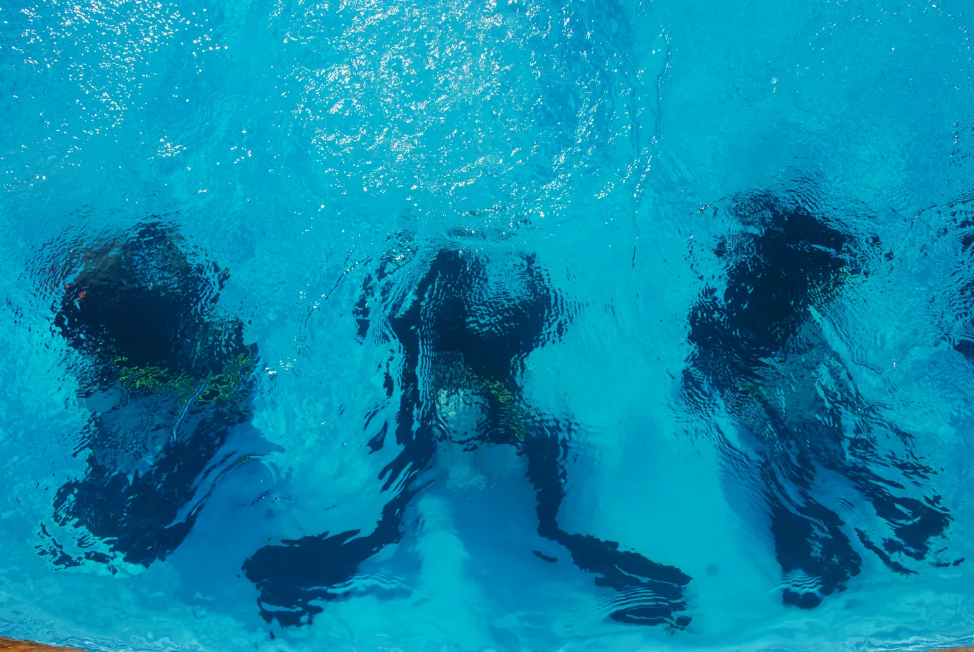 Divers practising underwater skills in the training pool