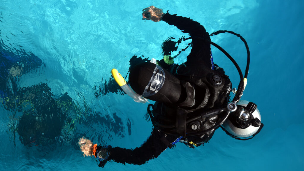Scuba Diver observing underwater practice on PADI IDC course