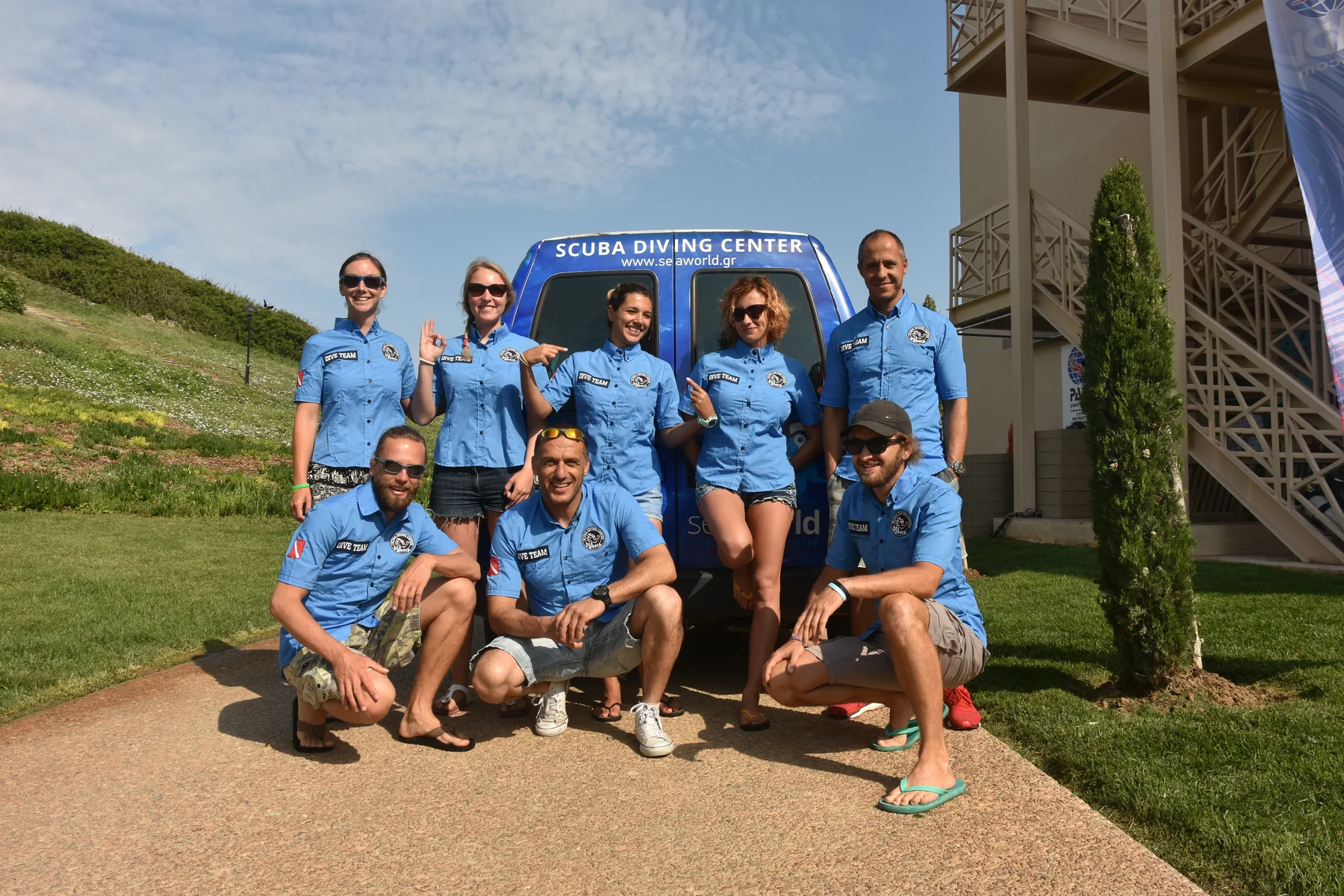 The SeaWorld diving center team together outside the dive center