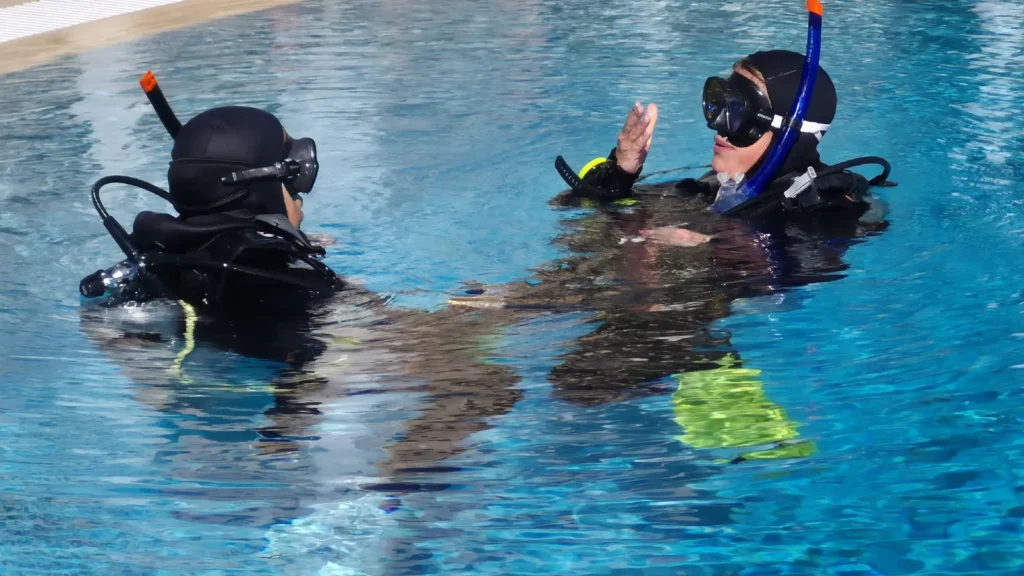 Instructor with students in the pool